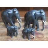FOUR EBONISED ELEPHANTS