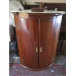 ANTIQUE BOW FRONTED MAHOGANY CORNER CUPBOARD