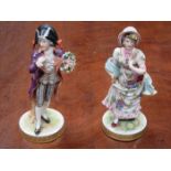 PAIR OF CONTINENTAL HANDPAINTED AND GILDED CERAMIC FIGURES,