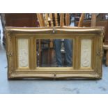 GILDED FRAMED WALL MIRROR MOUNTED WITH RELIEF DECORATED PANELS