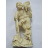 VICTORIAN ORIENTAL IVORY FIGURE GROUP DEPICTING A FISHERMAN,