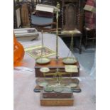 THREE SETS OF BRASS BALANCE SCALES AND SET OF POSTAL SCALES WITH WEIGHTS PLUS SET OF GOLD SCALES