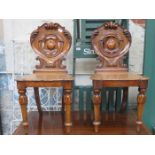 PAIR OF CARVED AND PIERCEWORK DECORATED VICTORIAN HALL CHAIRS