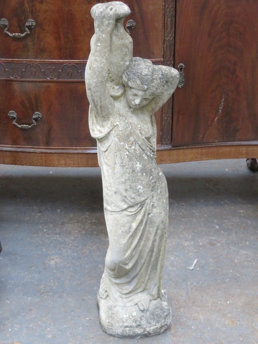 STONEWARE GARDEN ORNAMENT OF A WATER CARRIER,