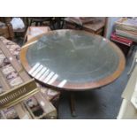 LEATHER TOPPED CIRCULAR COFFEE TABLE ON QUADRAFOIL SUPPORTS