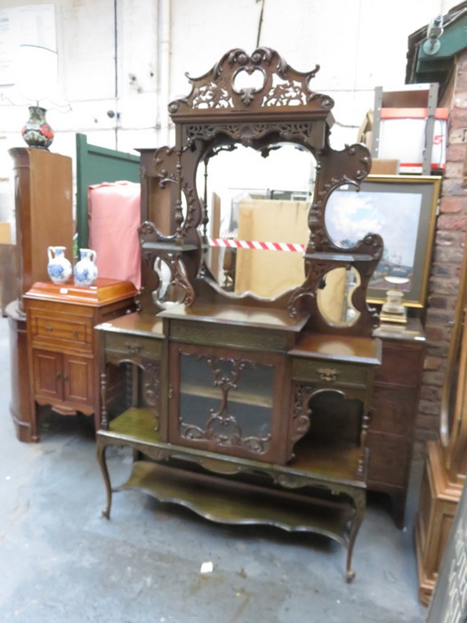 VICTORIAN HEAVILY CARVED AND PIERCEWORK DECORATED MIRRORBACK CHIFFONIER