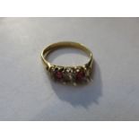 GOLD DRESS RING SET WITH CLEAR STONES AND RUBY COLOURED STONES