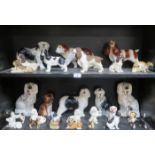 LARGE QUANTITY OF GLAZED AND UNGLAZED CERAMIC DOGS INCLUDING BESWICK