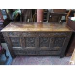 HEAVILY CARVED FRONTED ANTIQUE OAK TWO DRAWER COFFER