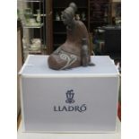 BOXED LLADRO GLAZED AND UNGLAZED STONEWARE EFFECT SEATED FIGURE, AFRICANIA (AT FAULT),