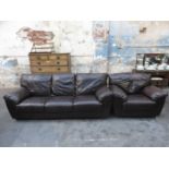 BROWN LEATHER UPHOLSTERED THREE SEATER SETTEE AND ARMCHAIR