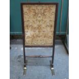 ANTIQUE MAHOGANY EMBROIDERED FIRESCREEN ON BRASS SUPPORTS