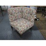 ANTIQUE UPHOLSTERED CORNER ARMCHAIR ON MAHOGANY SUPPORTS