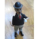 UNBOXED TINPLATE CLOCKWORK FIGURE OF CHARLIE CHAPLIN WITH REVOLVING WALKING STICK AND KEY BY SCHUCO