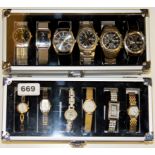 A case of gent's wrist watches and a case of ladies wrist watches.