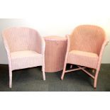 Two Lloyd loom armchairs and a linen basket.