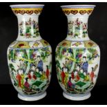 A pair of early/ mid-20th Century Chinese hand enamelled porcelain vases, H. 41cm.