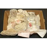 A box of mixed linen and lace.