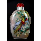 A superb large Chinese inside painted snuff bottle of a pair of pheasants with a cornelian