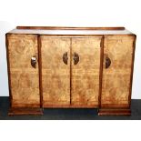 An Art Deco walnut veneered sideboard, W. 137cm.