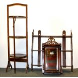 An oak cake stand, an Edwardian wall mirror and a book rack