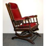 A 19th Century upholstered rocking chair.