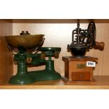 A vintage kitchen scale and coffee grinder.