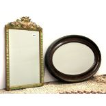 A 1920's barbola wall mirror, H. 58cm, together with a further oval mirror.