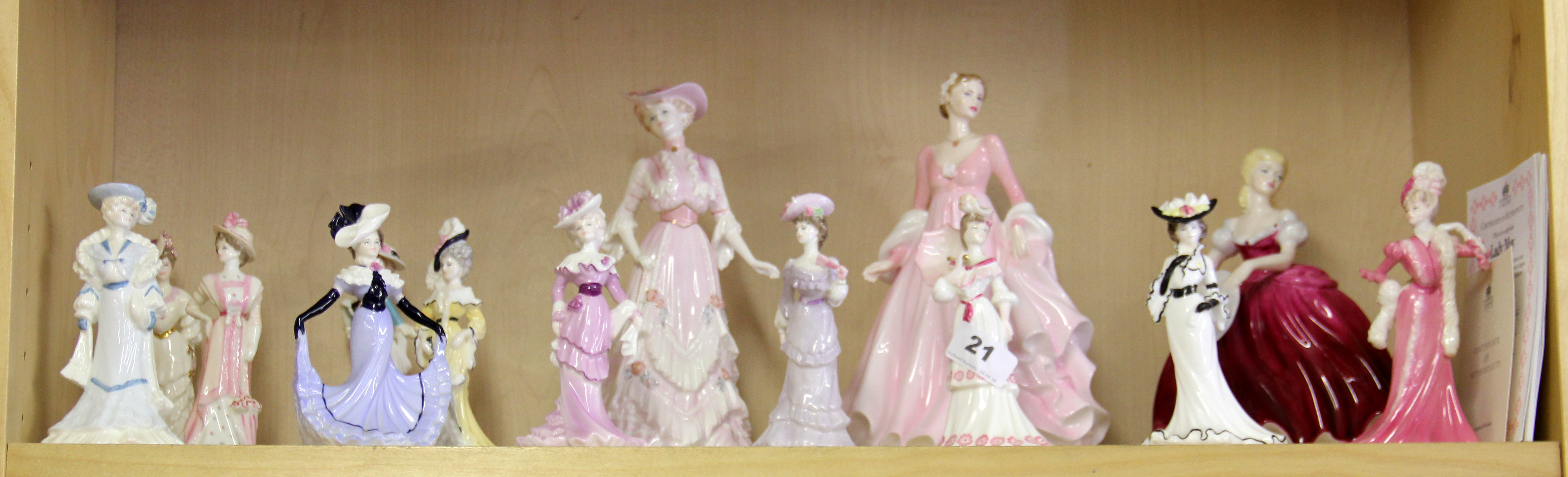 A quantity of Coalport figurines.