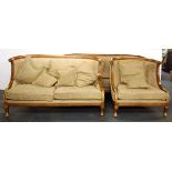 A superb French Empire style upholstered three seater settee with gilt acanthus leaf decoration,