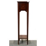 A single drawer mahogany plant stand, H. 112cm.