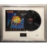 Autograph interest. A Framed copy of Def Leppard, 70 x 55cm, with Past & Present certificate.