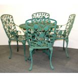 A painted metal garden table and chairs.