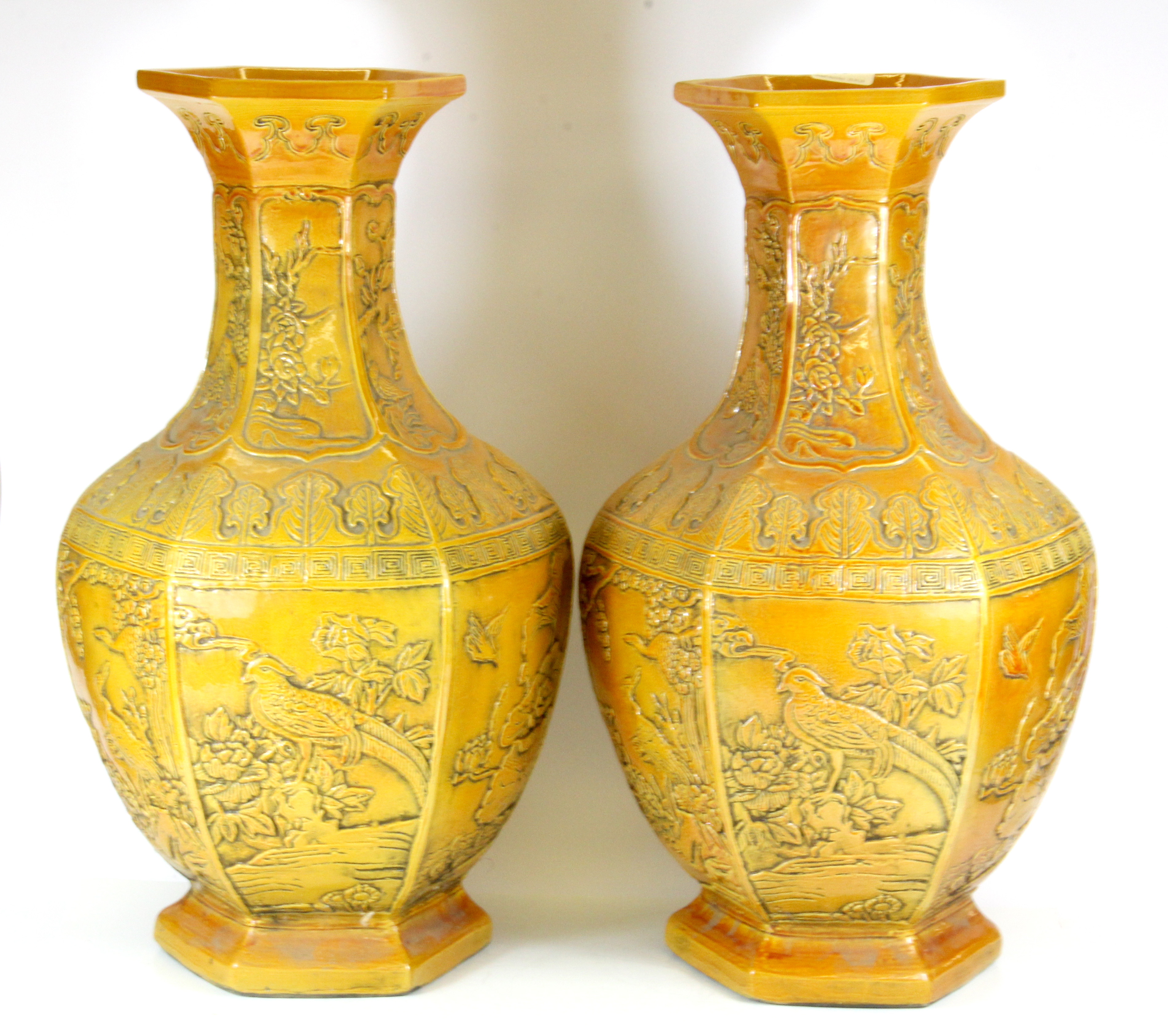 A superb pair of large Chinese relief decorated hexagonal porcelain vases, with impressed six