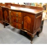 A 1920's bow front mahogany sideboard, W. 153cm.