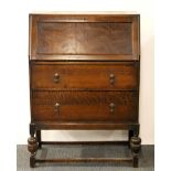 A 1930's oak bureau, W. 70cm.