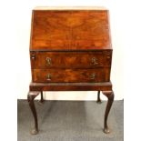 A 1930's mahogany veneered bureau, W. 69cm.