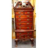 An ornate mahogany chest of drawers, H. 159cm.