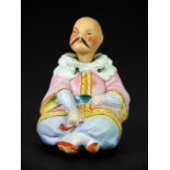 A 19th century German bisque porcelain figure of a nodding Chinaman, H. 7cm.