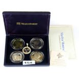 A boxed Marilyn Monroe commemorative coin set including two .999 silver coins and a further silver