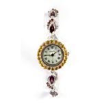 A lady's Quartz 925 silver wrist watch set with yellow sapphires and tourmalines, in good working