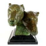 A large bronze of two greyhound heads on a black marble base, H. 29cm, L. 49cm.