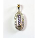 A 9ct white gold tanzanite and diamond set pendant.