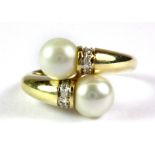 A 14ct yellow gold pearl and diamond set ring, (L).