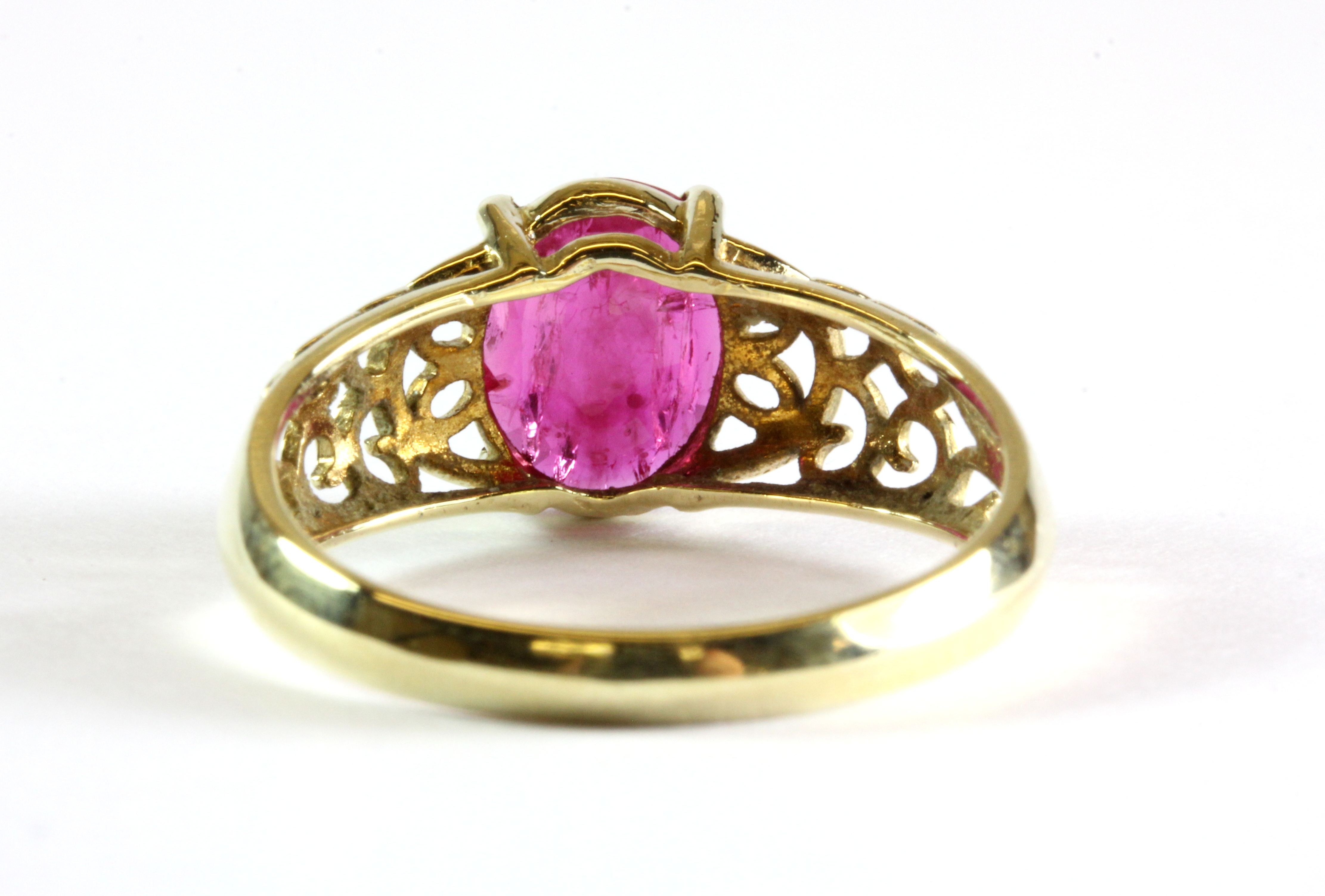 A 9ct yellow gold ring set with a 1.3ct oval cut ruby, (P.5). - Image 3 of 3