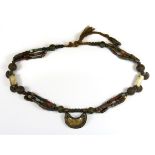 An interesting Tibetan nomad necklace of glass beads, bone and other materials, overall L. 72cm.