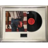 Autograph interest. A framed autographed LP record of Bruce Springsteen Born in the USA with