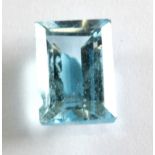 An unmounted emerald cut 3.62ct blue topaz.