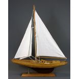 A handmade wooden model yacht, L. 26cm.