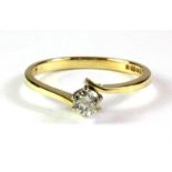 An 18ct yellow gold diamond set solitaire ring, (K).